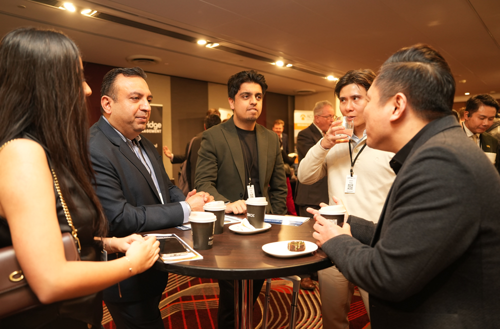 Investor conversation around a networking table